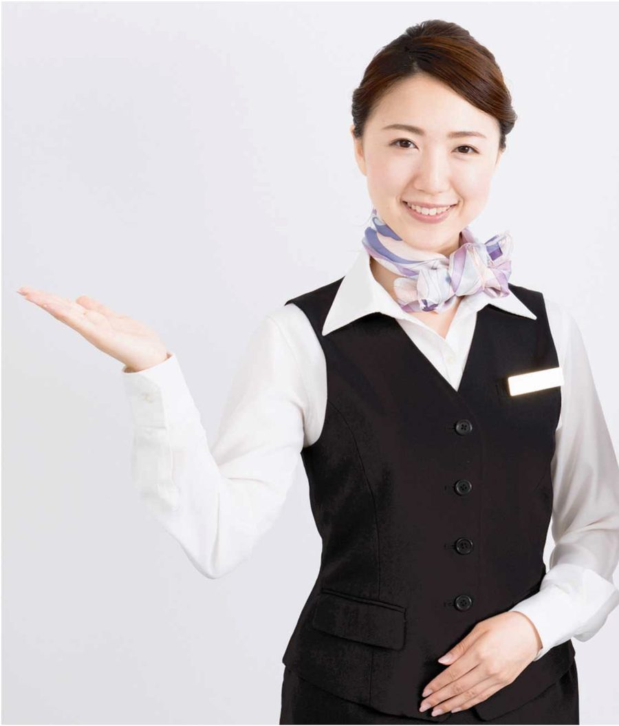 笑顔でご案内する受付スタッフ